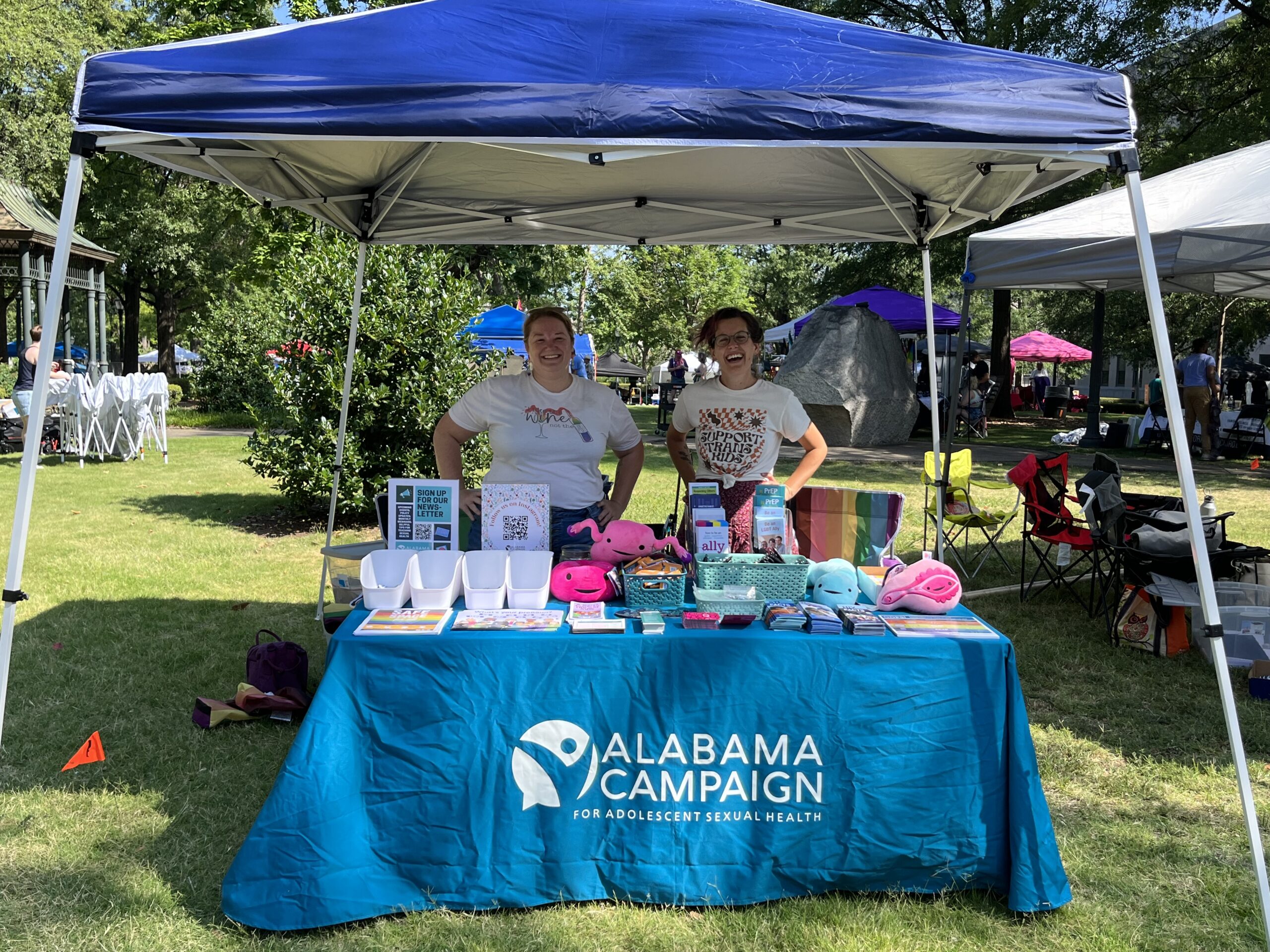 Executive Director, Christina Clark Okarmus, and Outreach Coordinator, Meagan Lyle, tabling at the 2023 PrideFest in Birmingham